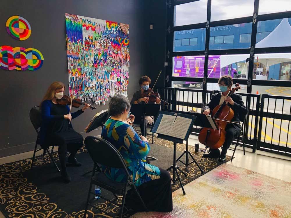 The Camilli String Quartet performing at the virtual Reach to Teach celebration at the Ink & Easel Studio at The Arts Connection.