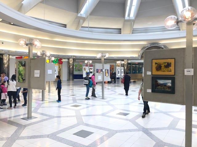 Visitors study the artwork of local Richmond artists at our 8th Annual Midsummer Arts Dream at Lansdowne Centre.