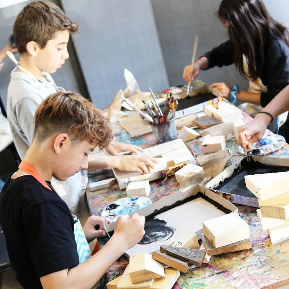 A Grade 7 student works on an assemblage piece inspired by artist Kurt Schwitters during a Reach to Teach: Immersed in the Arts session at The Arts Connection.