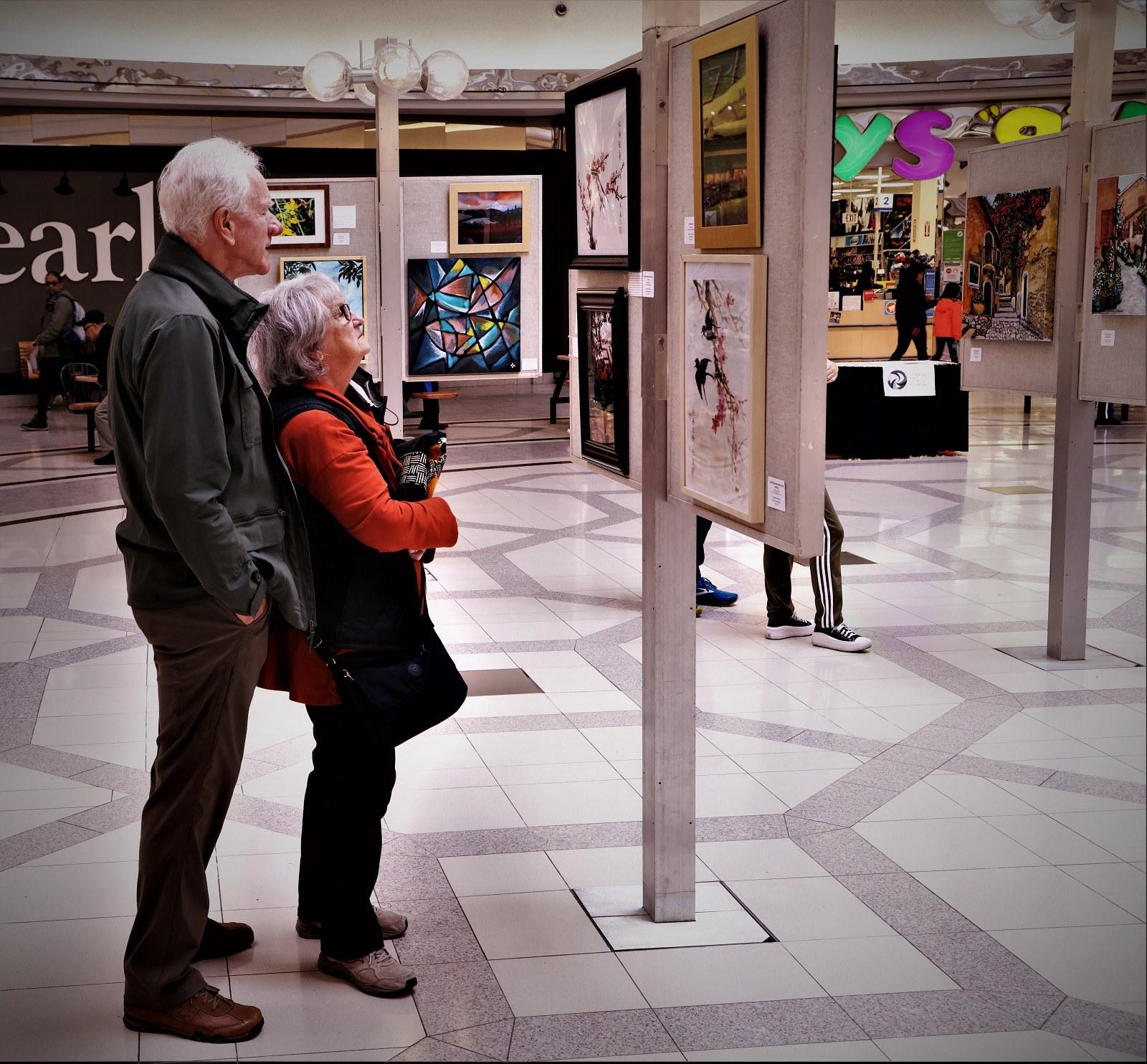 Guests take in the artwork at our 2023 Shades of Fall Art Exhibition at Lansdowne Centre.